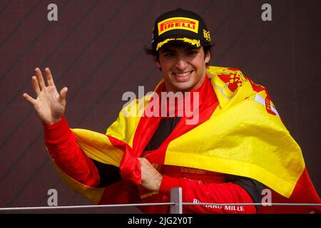 Carlos Sainz celebrates winning his first ever F1 Grand Prix on the podium at the F1 British Grand Prix. Carlos Sainz wins his first F1 race at the Br Stock Photo