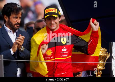 Carlos Sainz celebrates winning his first ever F1 Grand Prix on the podium at the F1 British Grand Prix. Carlos Sainz wins his first F1 race at the Br Stock Photo