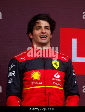 Carlos Sainz celebrates winning his first ever F1 Grand Prix on the podium at the F1 British Grand Prix. Carlos Sainz wins his first F1 race at the Br Stock Photo