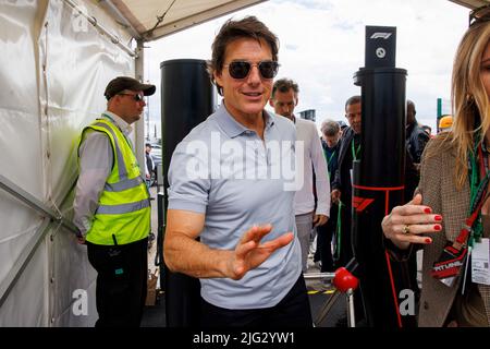 Tom Cruise walks through the paddock at Silverstone ahead of the 2022 F1 British Grand Prix Stock Photo