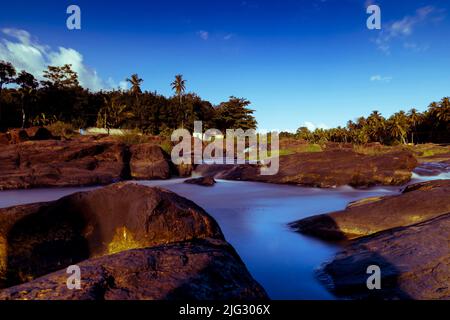 Beautiful waterfall scene at Aruvikarai, Kanyakumari District, Tamil Nadu, India. Long Exposure Shot. Stock Photo