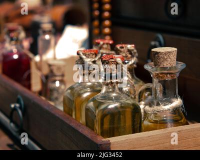 small bottles of tinctures, medicines or scented oils on the counter Stock Photo