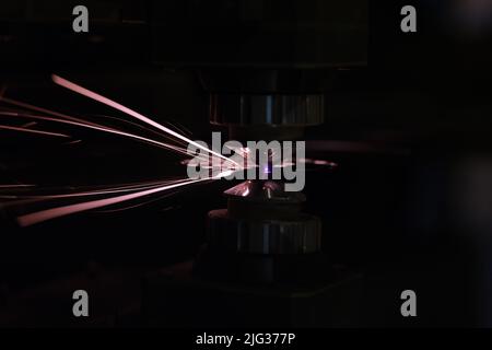 Process of cutting metal using plasma cutting in dark Stock Photo