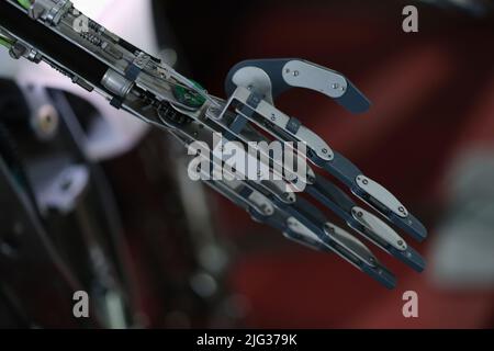 Future technologies in black prosthetic arm robot Stock Photo
