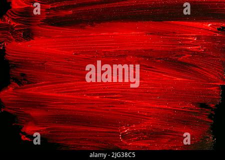 wet red paint splash on black background. Abstract vibrant background banner Stock Photo