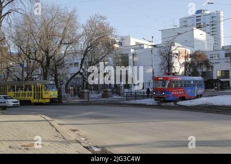 Colorful Russian trams on the streets of Yekaterinburg in Russia, on a sunny winter day Stock Photo