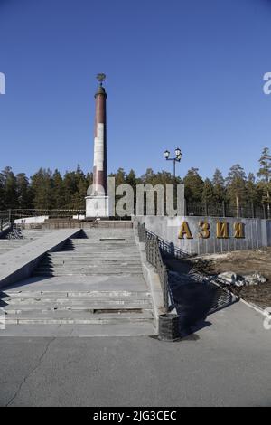 Monumental obelisk on the border between Europe and Asia in a forest near Ekaterinburg, Russia Stock Photo