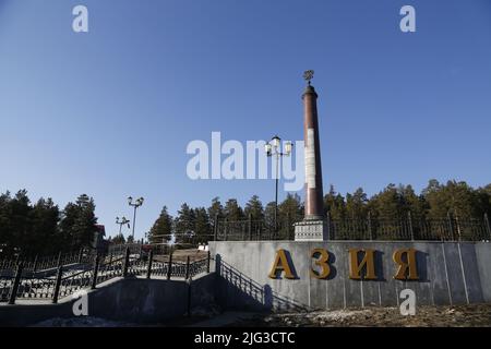 Monumental obelisk on the border between Europe and Asia in a forest near Ekaterinburg, Russia Stock Photo