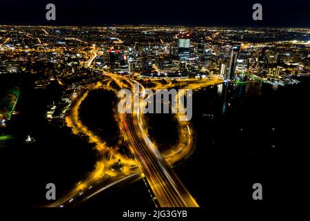 Aerial long exposure of Perth city at night including the freeway traffic and river Stock Photo