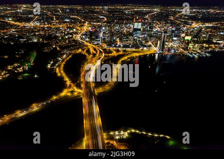 Aerial long exposure of Perth city at night including the freeway traffic and river Stock Photo