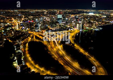 Aerial long exposure of Perth city at night including the freeway traffic and river Stock Photo