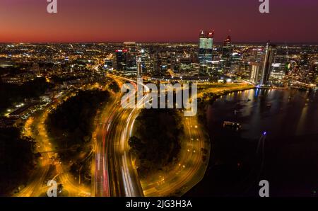 Aerial long exposure of Perth city at night including the freeway traffic and river Stock Photo