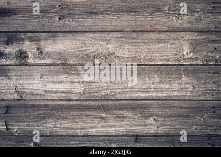Shabby dark wood texture. Vintage wooden fence, desk surface. Natural color. Weathered timber, background. Gray old wood planks. Blank space. Template Stock Photo