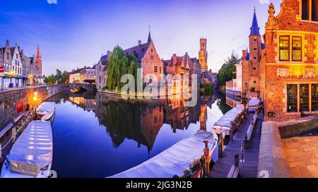 Bruges, Belgium. Blue hour landscape with beautiful Rozenhoedkaai in Brugge, famous Flanders landmark. Stock Photo
