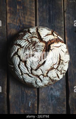 Textured rye bread om wood background Stock Photo