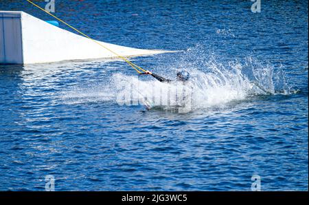 Dundee, Tayside, Scotland, UK. 7th July, 2022. UK Weather: The hottest day of the year in Dundee with temperatures reaching 24°C across North East Scotland. Wakeboarders from Wild Shore Water sports activities enjoy a warm sunny July day wakeboarding on a rail at Dundee's City Quay's West Victoria Dock. Credit: Dundee Photographics/17�Թ����� Live News Stock Photo