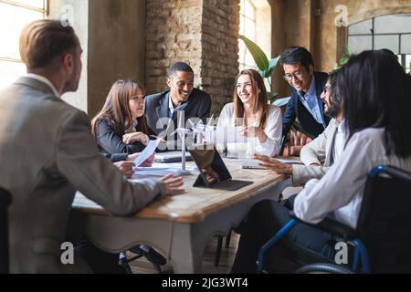 Group of multiethnic businesspeople discussing about financial strategy, renewable power, sustainable innovation project and environmental economical Stock Photo