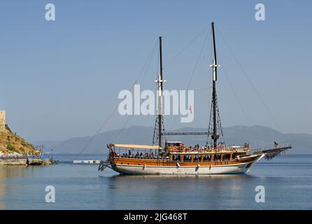 Kusadasi, Turkey - June May 2022: Tourist boat taking visitors on a trip around the coast Stock Photo