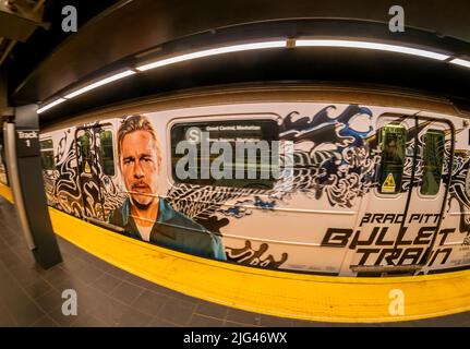 The giant face of Brad Pitt greets commuters in a wrapped 42nd Street shuttle train in Times Square in New York on Saturday, July 2, 2022. The advertising is for the film Bullet Train starring Pitt, and Sandra Bullock among others with a release date of August 5. (© Richard B. Levine) Stock Photo