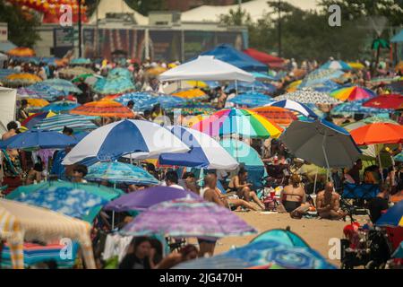 Thousands of beachgoers flock to Coney Island in Brooklyn in New York on Independence Day, Monday, July 4, 2022. Visitors mobbed the beach and the surf on the humid holiday.  (© Richard B. Levine) Stock Photo