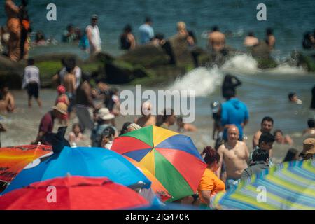 Thousands of beachgoers flock to Coney Island in Brooklyn in New York on Independence Day, Monday, July 4, 2022. Visitors mobbed the beach and the surf on the humid holiday.  (© Richard B. Levine) Stock Photo