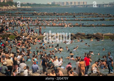 Thousands of beachgoers flock to Coney Island in Brooklyn in New York on Independence Day, Monday, July 4, 2022. Visitors mobbed the beach and the surf on the humid holiday.  (© Richard B. Levine) Stock Photo