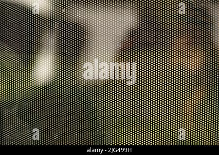 Mesh texture on glass. Shooting window. Small cage. Textured surface. Stock Photo