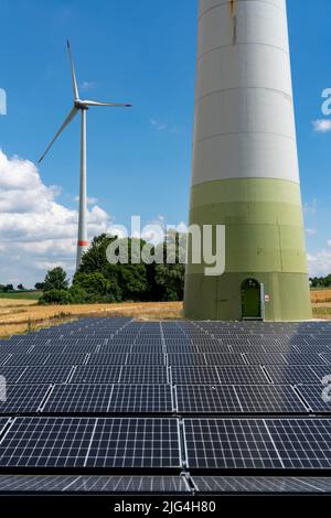 Wind farm near Lichtenau, East Westphalia-Lippe, a 100 kW solar power system was installed on the crane installation area in front of a wind turbine, Stock Photo