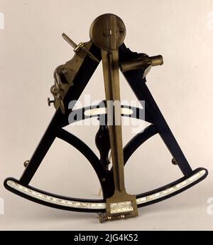 Sextant (Siglo XVIII). Sextant. No builder data. Metal Bastor in the form of a circular sector of 60º amplitude. In its anterior face, a limbo is recessed on which the alidada slips, which revolves around the zero center of the limbo. The alidada carries at its end an Nonian that moves graduated, and to fix it the device is provided with a pressure screw and a coincidence; By half of the same a magnifying glass with a look to read the graduation. Perpendicular to the plane of the limbo are the mirrors: one attached to the alidada and another to one of the arms of the frame, they have half tran Stock Photo