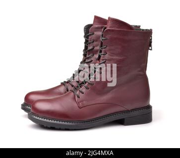 Side view of maroon leather winter ladies boots isolated on white Stock Photo