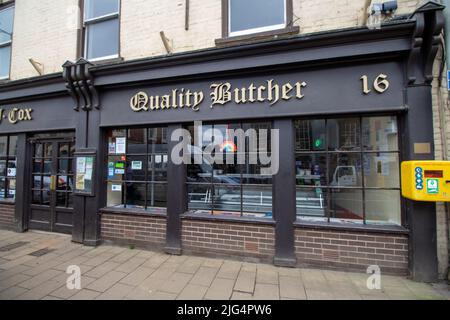 CREDITON, DEVON, UK - APRIL 6, 2022 Quality Butcher shop on the High Street Stock Photo