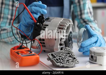 Automotive alternator repair test stator closeup with copper coil in workshop Stock Photo