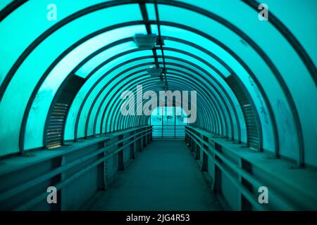 Blue tunnel. Empty pedestrian crossing. Details of urban infrastructure. Stock Photo