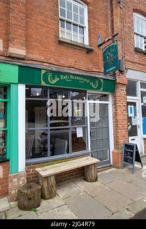 CREDITON, DEVON, UK - APRIL 6, 2022 R and G Barbershop on Market Street Stock Photo