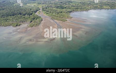 Aerial view of river mouthshowing delta with sediment build up Pacific ...