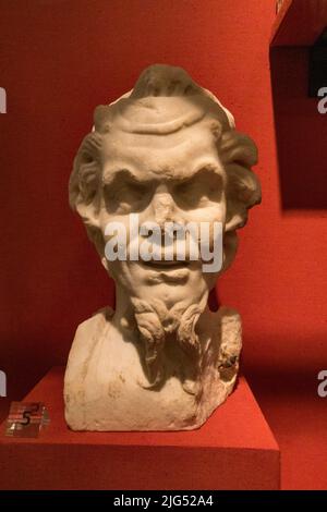 Marble head of Pan, the Greek god of shepherds, flocks,nature and rustic music (from Lanuvium, Italy) on display in the UK. Stock Photo