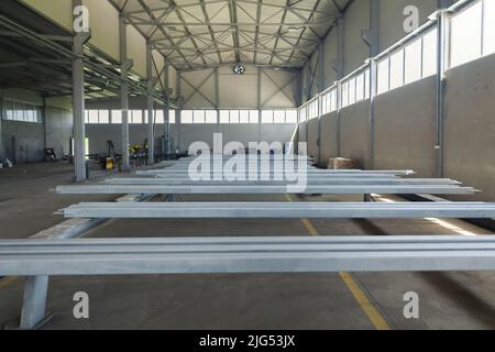 steel construction of the hall roof with insulating panels Stock Photo