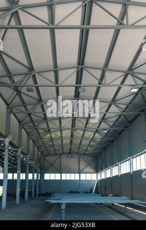 steel construction of the hall roof with insulating panels Stock Photo