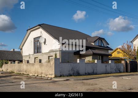 two-story concrete or brick country house Stock Photo