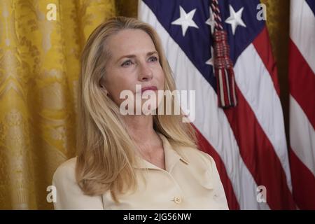 Washington, DC, July 7, 2022. Laurene Powell Jobs, widow of Apple co-founder Steve Jobs, listens prior to accepting the Medal of Freedom for her husband from United States President Joe Biden during a ceremony in the East Room of the White House in Washington, DC on Thursday, July 7, 2022. Credit: Chris Kleponis/CNP /MediaPunch Stock Photo