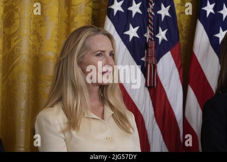 Washington, DC, July 7, 2022. Laurene Powell Jobs, widow of Apple co-founder Steve Jobs, listens prior to accepting the Medal of Freedom for her husband from United States President Joe Biden during a ceremony in the East Room of the White House in Washington, DC on Thursday, July 7, 2022. Credit: Chris Kleponis/CNP /MediaPunch Stock Photo