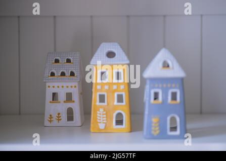 Small ceramic houses in a row Stock Photo