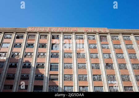 Millennium Mills facade, a derelict flour mill on the Royal Docks in Silvertown, East London, Currently undergoing redevelopmentde Stock Photo