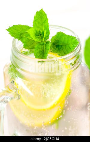 Lemon mint water with ice.Citrus cocktail with mint. Sassy lemon water.Lemon summer drink. Stock Photo