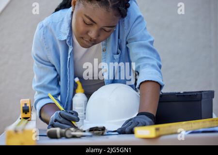 Dont be afraid to give your best. Shot of a young woman working outside. Stock Photo