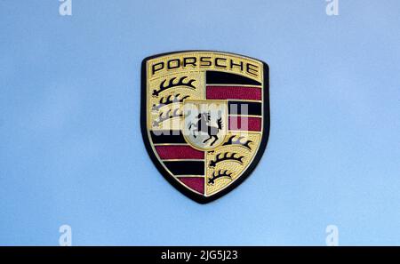 A vintage Porsche Stuttgart hood crest or emblem on a Porsche on display at a car show in Santa Fe, New Mexico. Stock Photo