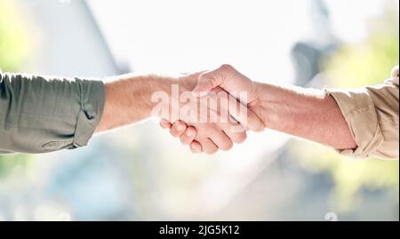 Between us is a whole lot of trust. Shot of two unrecognisable men shaking hands. Stock Photo