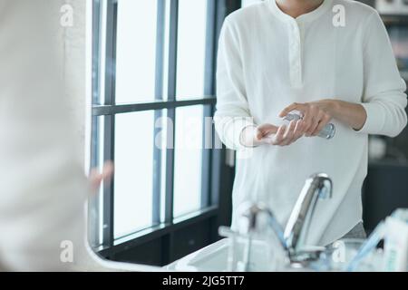 Japanese man doing skincare Stock Photo