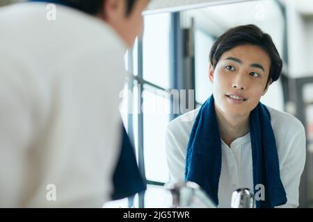 Japanese man doing skincare Stock Photo