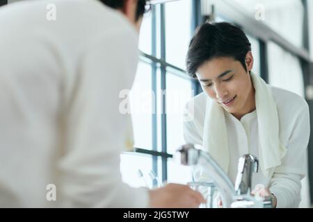 Japanese man doing skincare Stock Photo